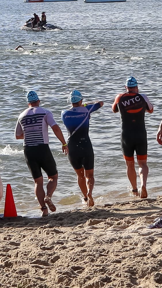 Cyclist on a closed road course, Gold Coast skyline in the background