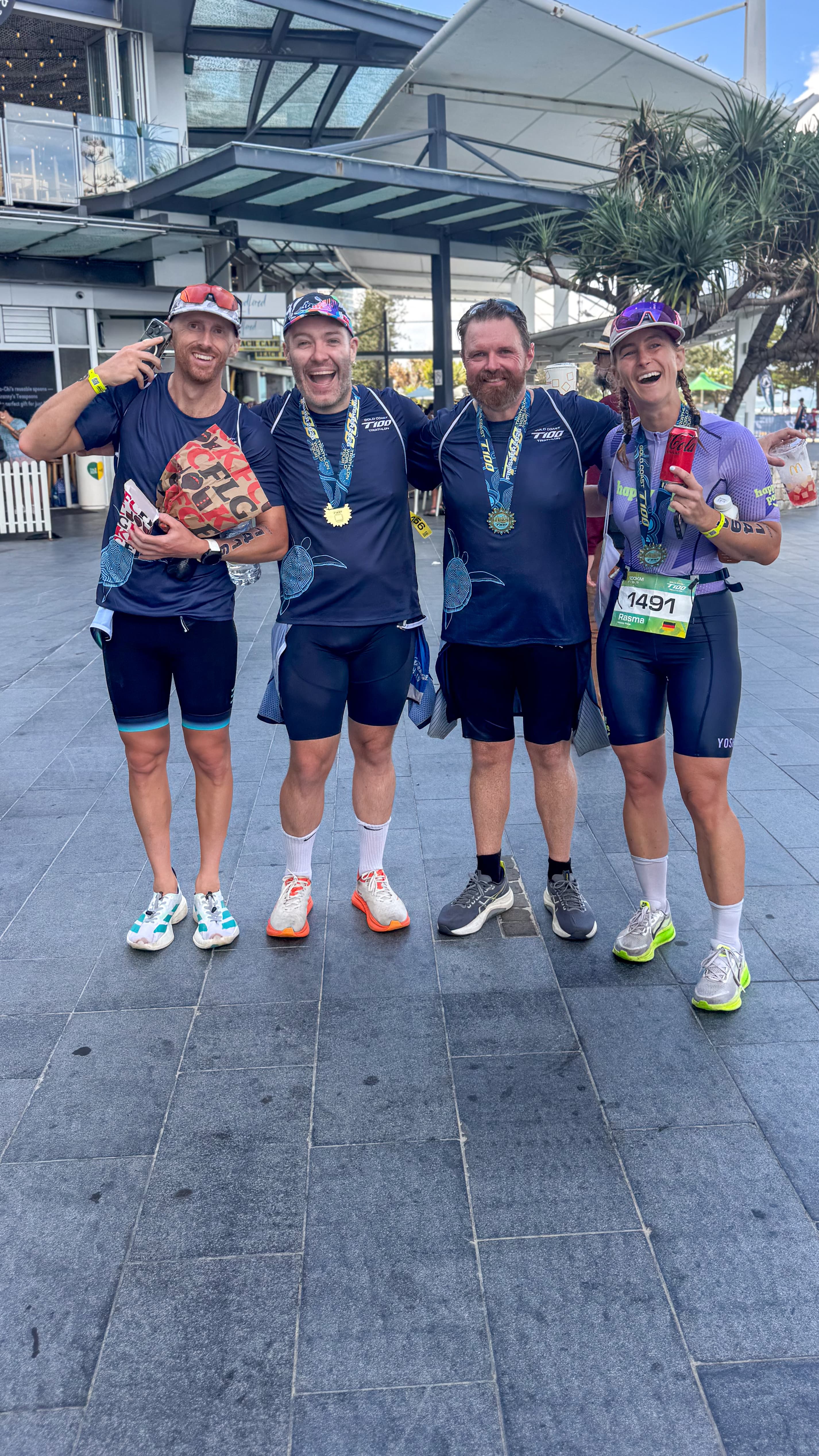 Athletes celebrating with medals after event